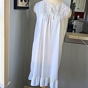 Vintage gown. Size medium.  White with green and pink enbroidery. Ruffle bottom.